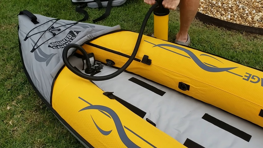 The Advanced Elements Island Voyage 2 kayak being inflated with a hand pump
