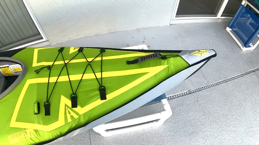 A rubber-lined carrying handle and a small storage area at the bow of the Advanced Elements AdvancedFrame Ultralite kayak