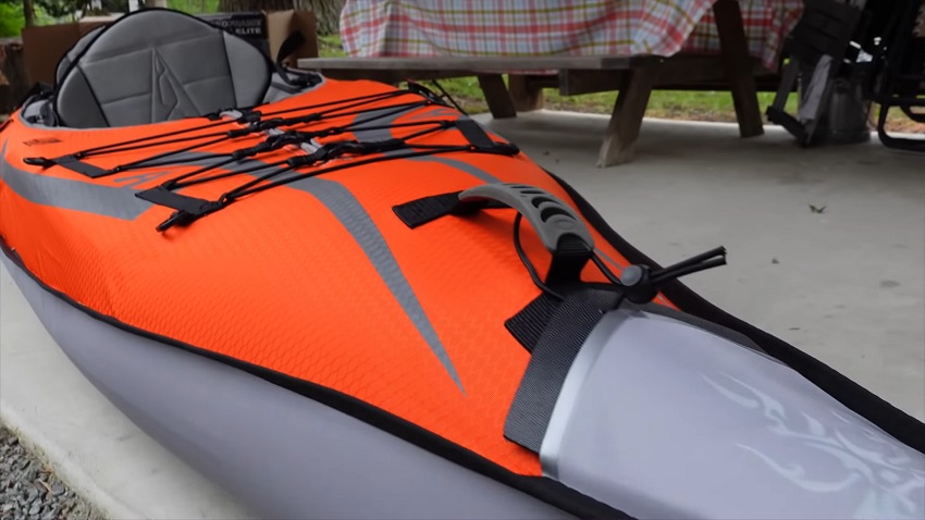 A front carrying handle and a bungee system with D-rings of the Advanced Elements AdvancedFrame Convertible Elite kayak