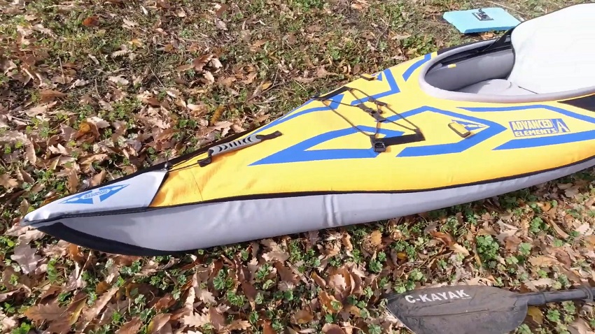 A rubber-lined handle and a bow storage area with a bungee tie-down system on the Advanced Elements AdvancedFrame Sport kayak