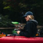 Lady fishing from a kayak