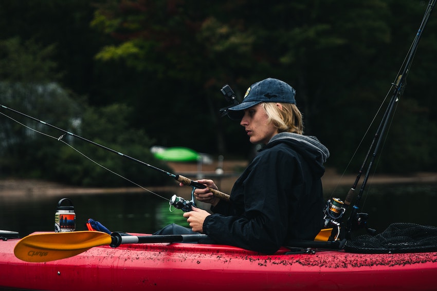 Lady fishing from a kayak