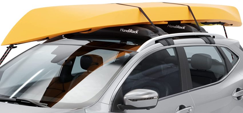 A yellow kayak resting on two inflatable roof racks