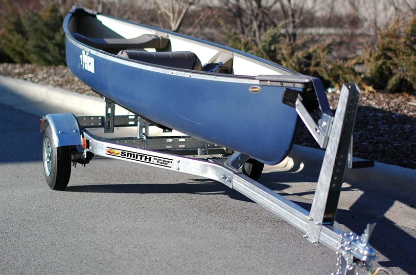 A blue canoe placed on a trailer