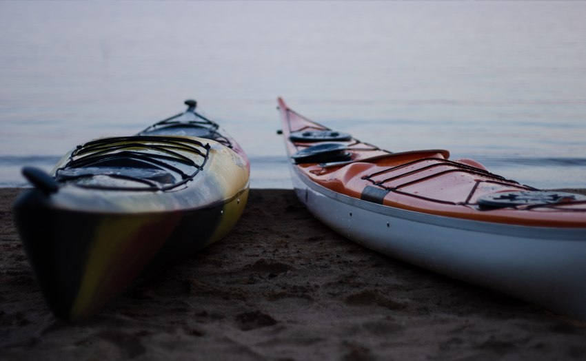 Two kayaks lying on the beach 