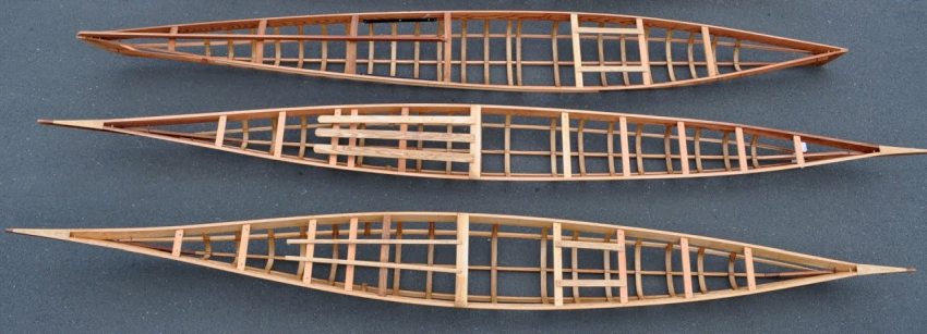 Three wooden kayak frames