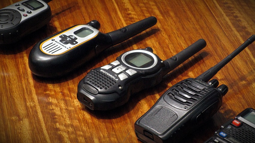 A set of walkie talkies lying on the table  
