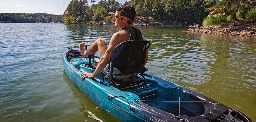 A man drives his pedal kayak on the water
