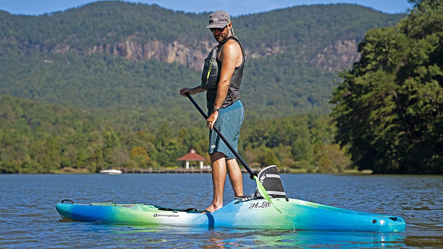 a man is on the SUP kayak hybrid