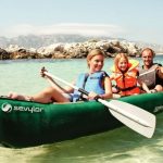 a family is on an inflatable canoe