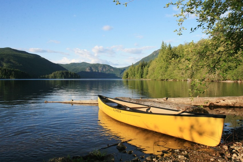 a yellow canoe on a lake
