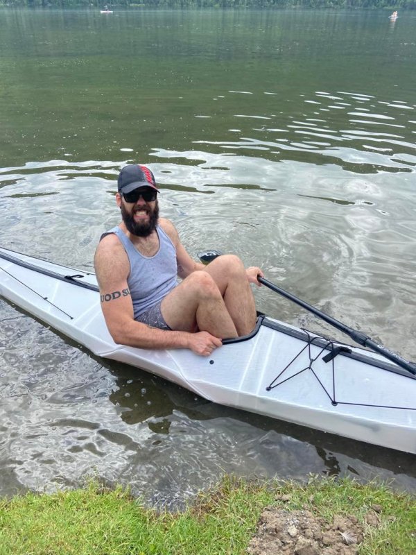 Author sits in ORU Bay ST kayak on the water