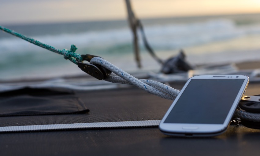 A smartphone lies on a vessel's deck