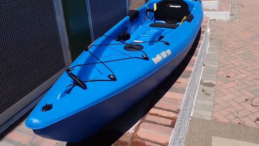  A t-handle and an open storage compartment of the Sun Dolphin Bali 12 SS kayak