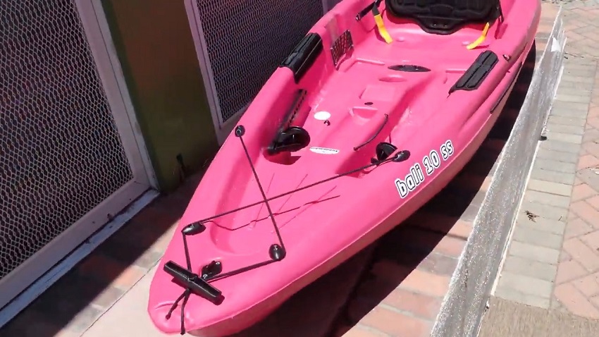 A t-handle, a drain plug and front storage area of the Sun Dolphin Bali 10 SS kayak