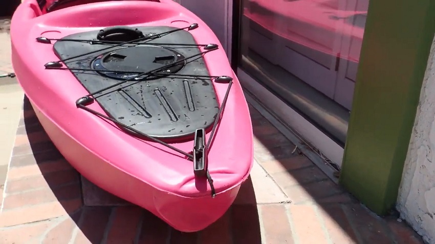 A large, watertight storage compartment with a removable bungee tie-down system of the Sun Dolphin Bali 10 SS kayak