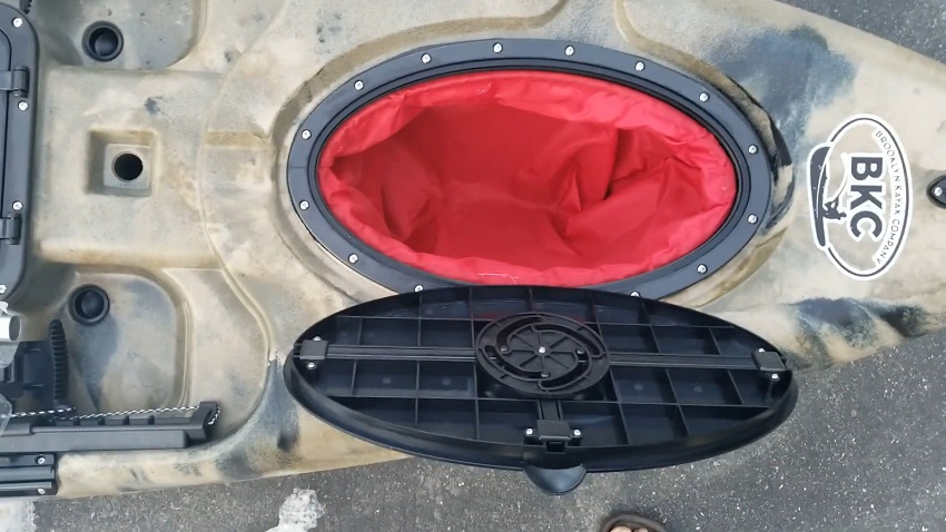 A waterproof oval hatch with an included dry bag of the BKC RA220 kayak