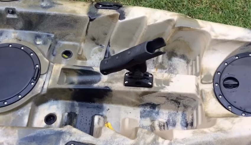 A single rod holder, step system footrests, and two scupper holes on the BKC FK184 kayak