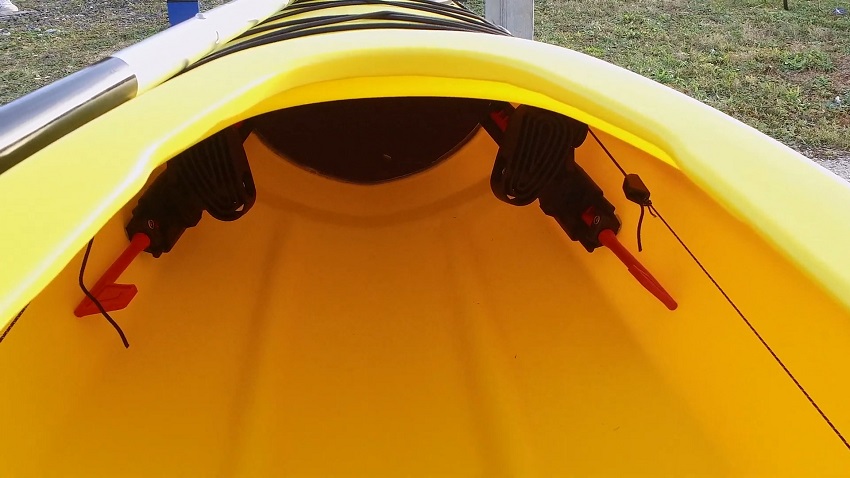 Adjustable footrests attached to the rudder control system inside the BKC SK287 kayak