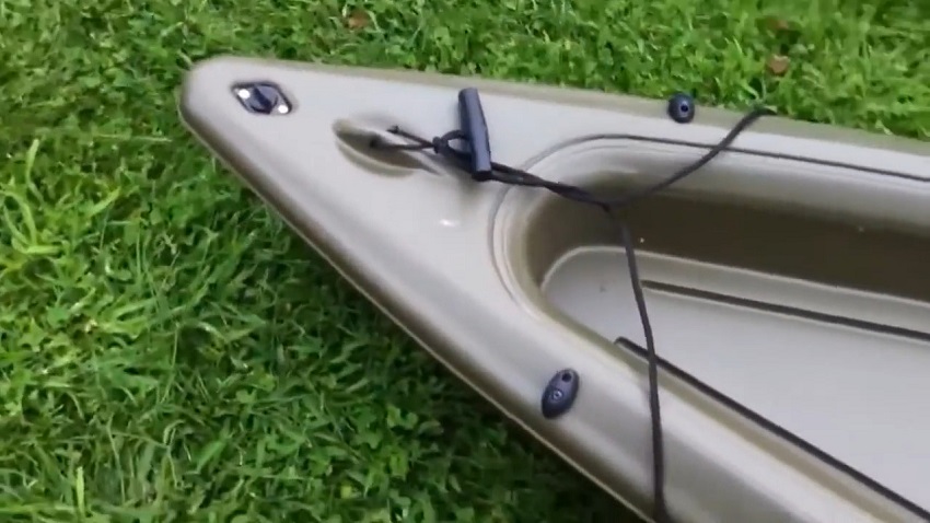 A carrying t-handle and a drain plug of the Sun Dolphin Journey 12 SS kayak