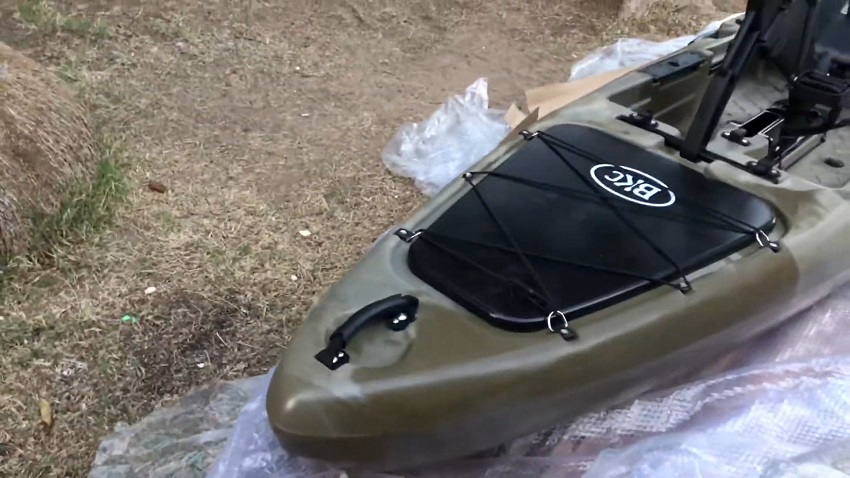 A rubber-lined handle and a triangular front storage system secured by removable bungee cords of the BKC PK13 kayak