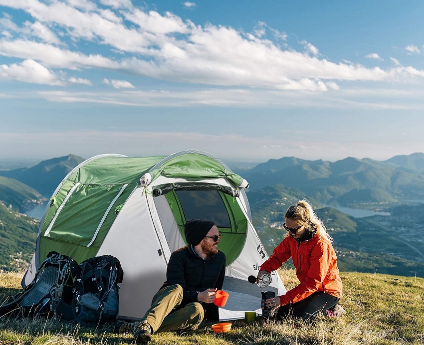 A couple sits outside an Eackrola 2-person tent