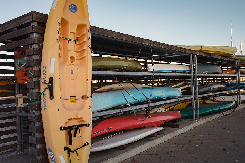 Used kayaks stored on racks