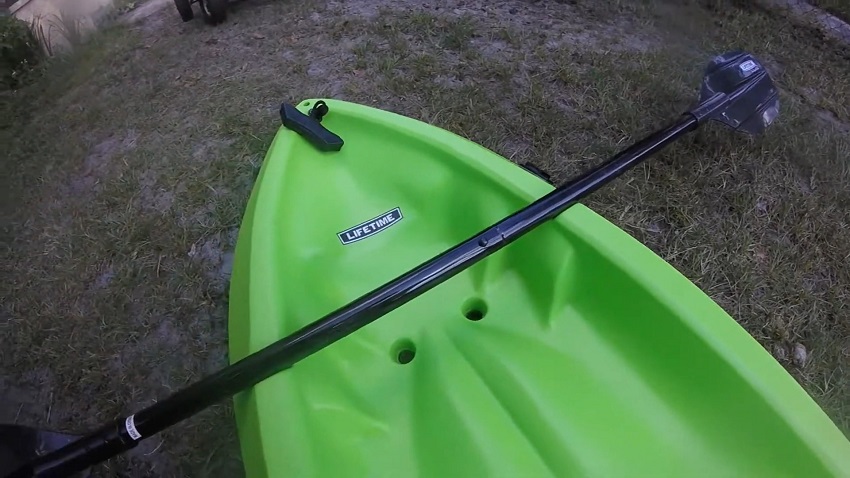 Bow area of the Lifetime Wave kayak with a paddle on it