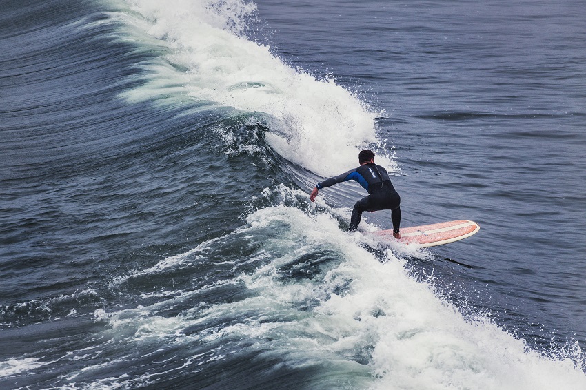 A man surfs the wave