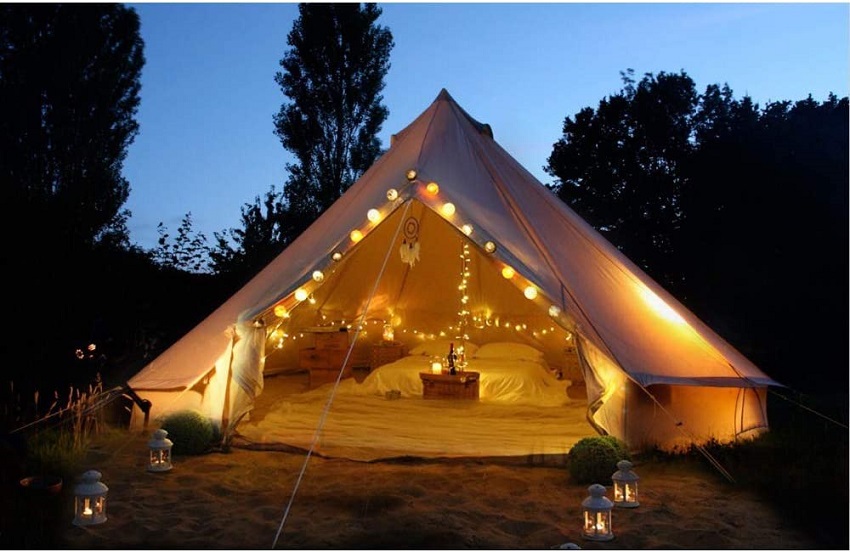 PlayDo Cotton Canvas Bell Tent with interior lights at night