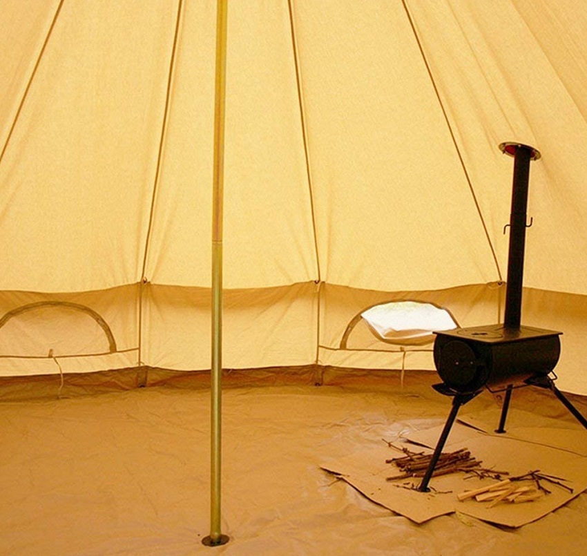 A wood burning stove inside the PlayDo Cotton Canvas Bell Tent