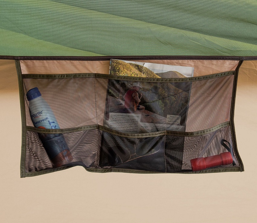 A ground-accessible, six-section hanging pocket inside the Ozark Trail Hazel Creek 20-Person Tunnel Tent