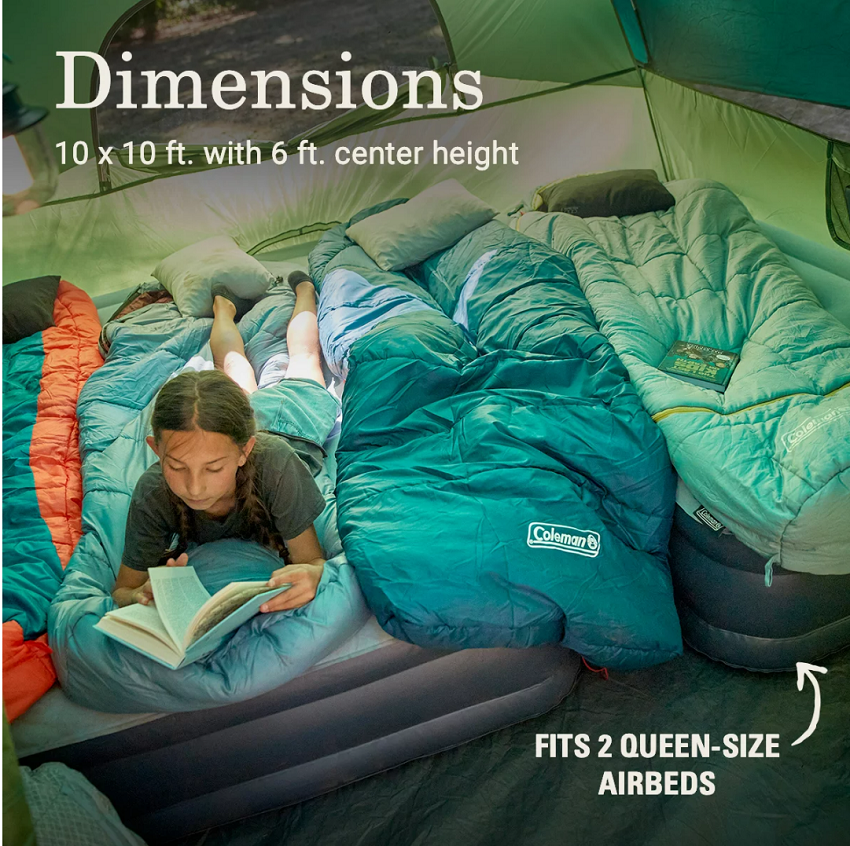 A girl reads a book, lying on an air bed inside the Coleman Sundome 6-Person Tent