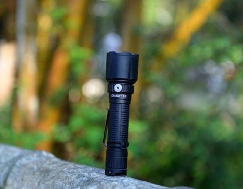 A handheld flashlight