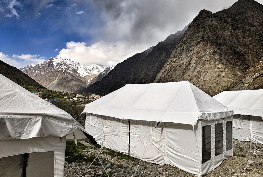 A big white canvas tent pitched in the mountains