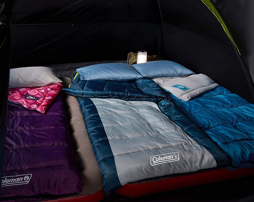 Two queen-sized beds inside the Coleman 6-Person Dark Room Sundome Tent