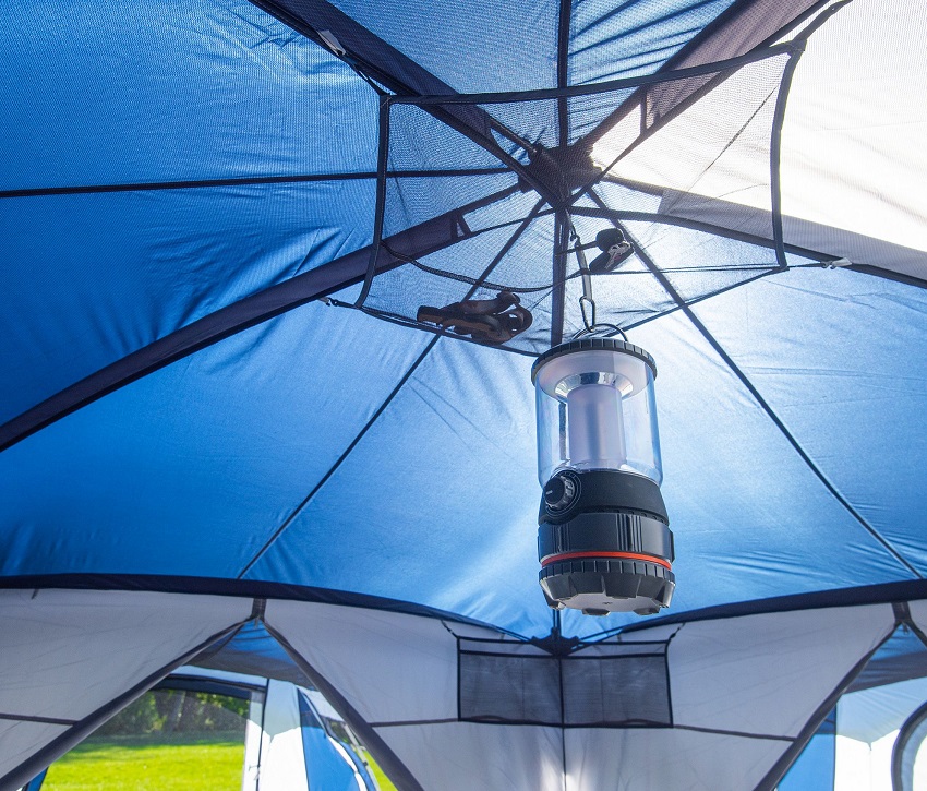 A gear loft, a hanging media pocket and a hanging lantern inside the Ozark Trail Hazel Creek 20-Person Star Tent