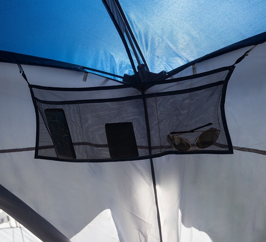 A three-section pocket in the common area of the Ozark Trail Hazel Creek 20-Person Star Tent