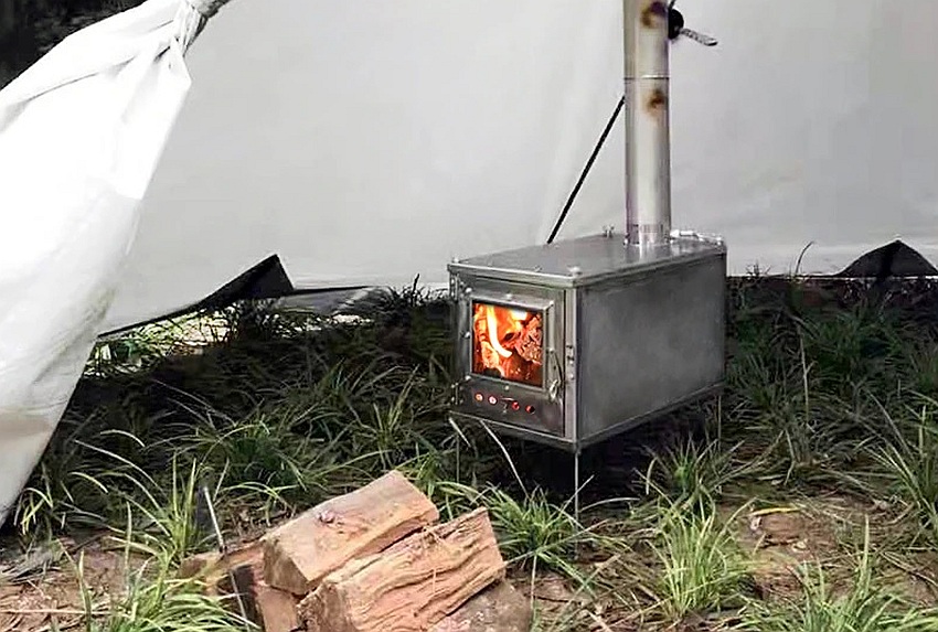 A wood stove inside a camping tent