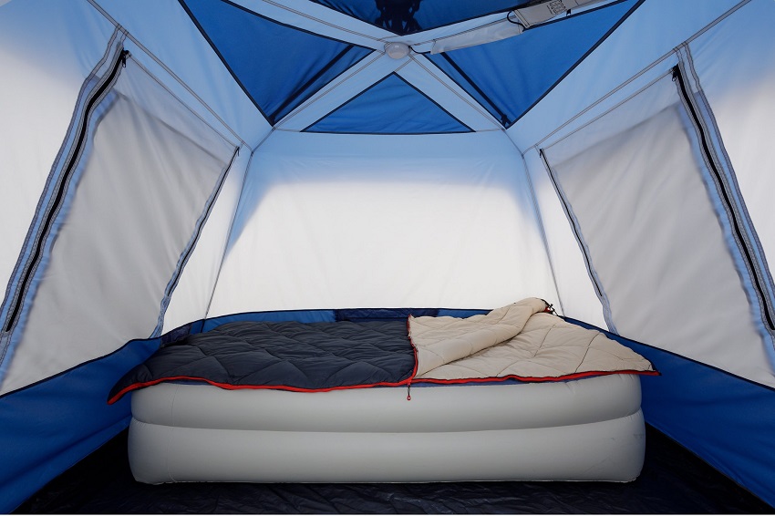 A queen-sized mattress inside the Ozark Trail 4-Person Instant Cabin Tent with LED Lighted Hub