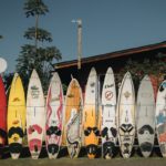 Paddle boards of different sizes and colors