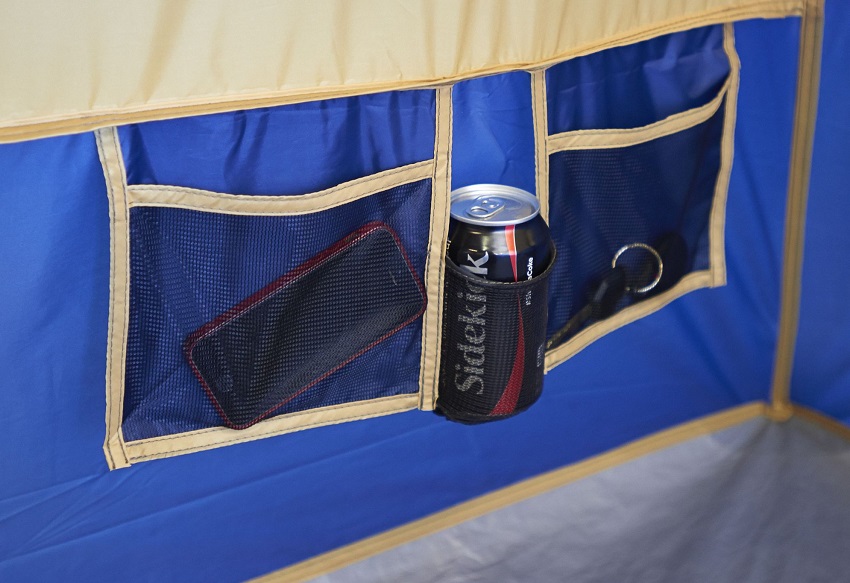 Two hanging mesh pockets and a hanging cup holder inside the Ozark Trail Base Camp 14-Person Cabin Tent