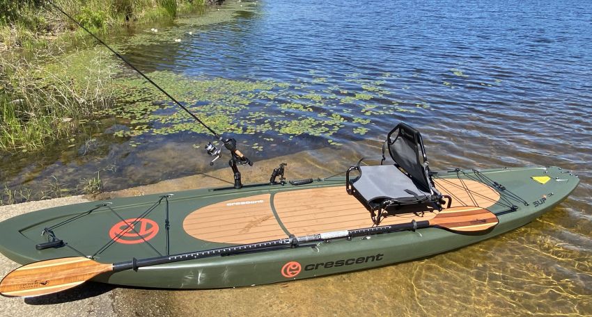 Crescent Kayaks SUP+ paddleboard with a seat, a paddle and a fishing rod 