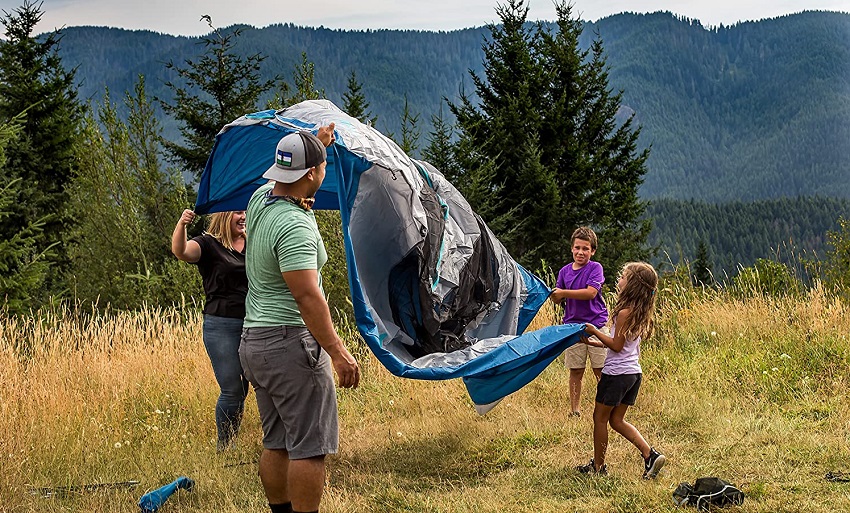 A family sets up Eureka Tetragon NX 2 Person Tent on the meadow
