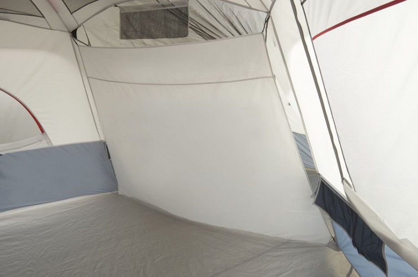 A hanging media pocket with adjustable straps and a room divider inside the Ozark Trail 20-Person Cabin Tent with 3 Separate Entrances