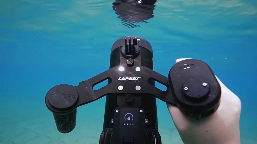 LEFEET S1 PRO Water Scooter is held by a human hand under water