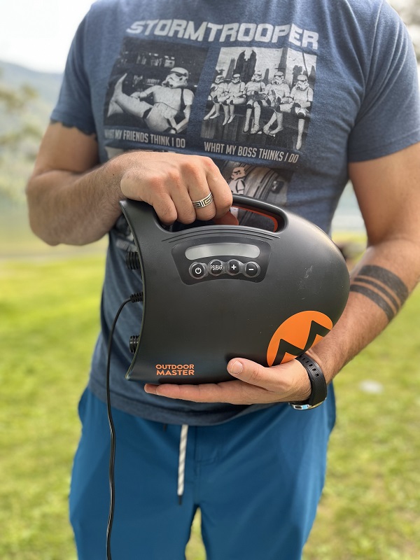 Author holds the OutdoorMaster Shark II SUP pump