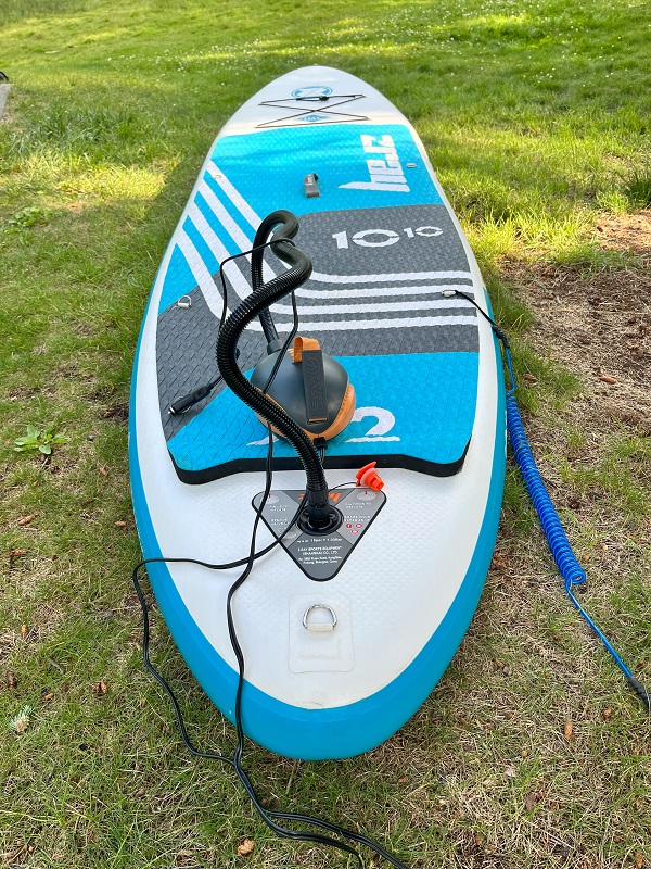 OutdoorMaster Dolphin SUP Pump is connected to a paddle board