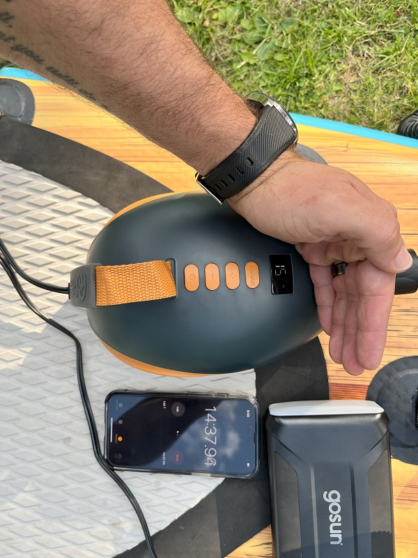 OutdoorMaster Dolphin SUP pump and a smartphone, measuring its inflation time