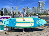 Author holds his iROCKER Cruiser SUP and a paddle